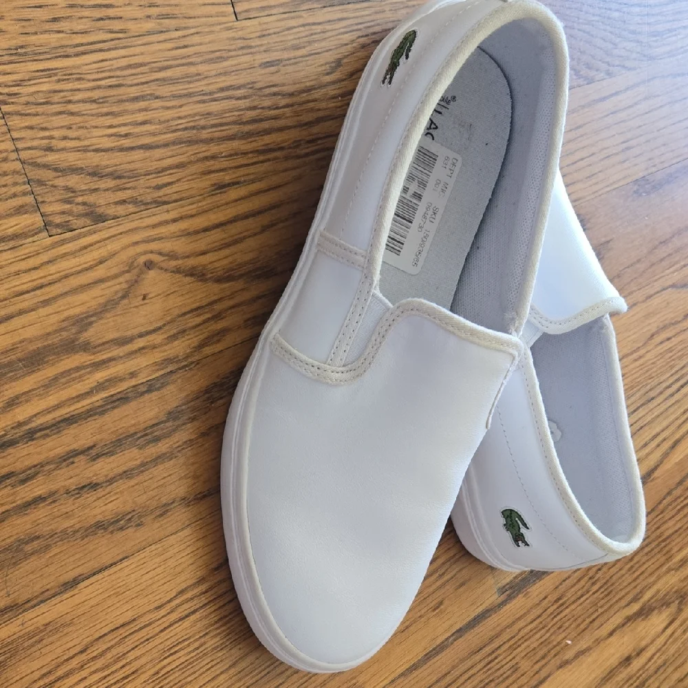 Lacoste Classic White Slip-On Shoes - Picture 1 of 4